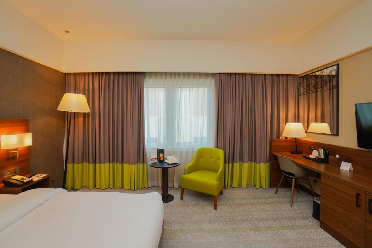 The Grand Lux Hotel Ντόχα Εξωτερικό φωτογραφία A room at the hotel