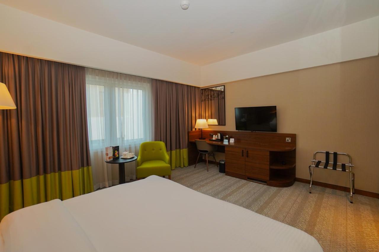 The Grand Lux Hotel Ντόχα Εξωτερικό φωτογραφία A room at the hotel
