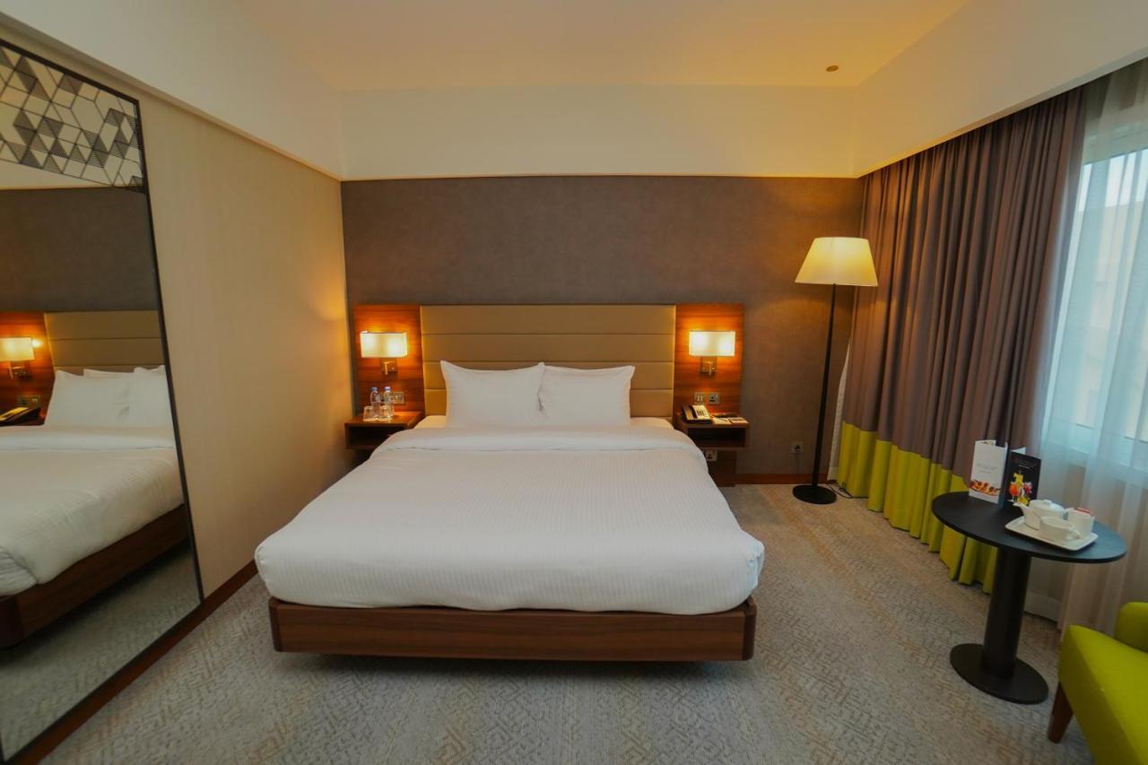 The Grand Lux Hotel Ντόχα Εξωτερικό φωτογραφία A room at the hotel