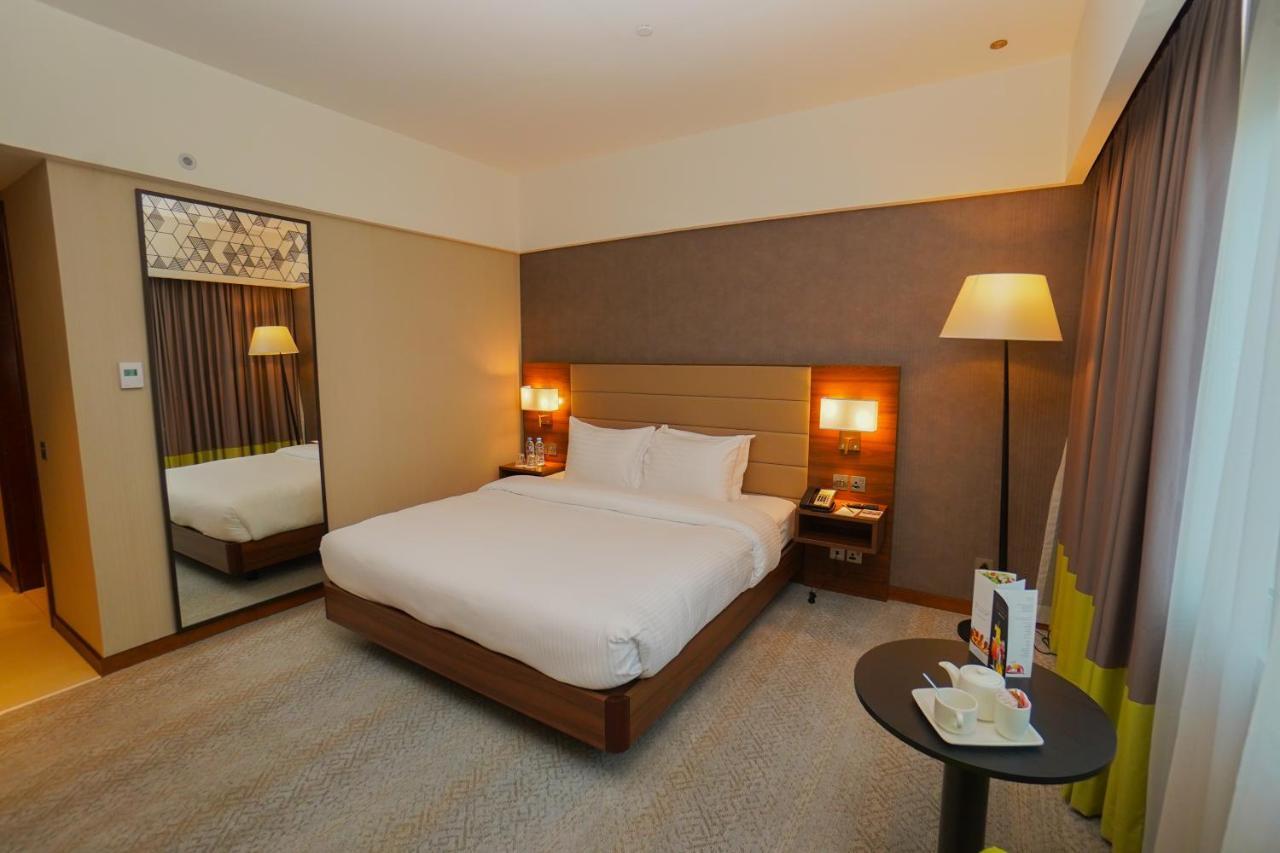 The Grand Lux Hotel Ντόχα Εξωτερικό φωτογραφία A room at the hotel